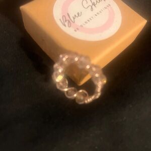 Handmade pink stones with gold wire.